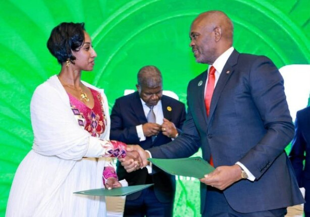 Dagmawit Moges Bekele, Director of the Peace Fund Secretariat, African Union (left), and Tony Elumelu, Group Chairman, United Bank for Africa (UBA), during the signing ceremony of agreement for the landmark donation of $500,000 by UBA to the African Union